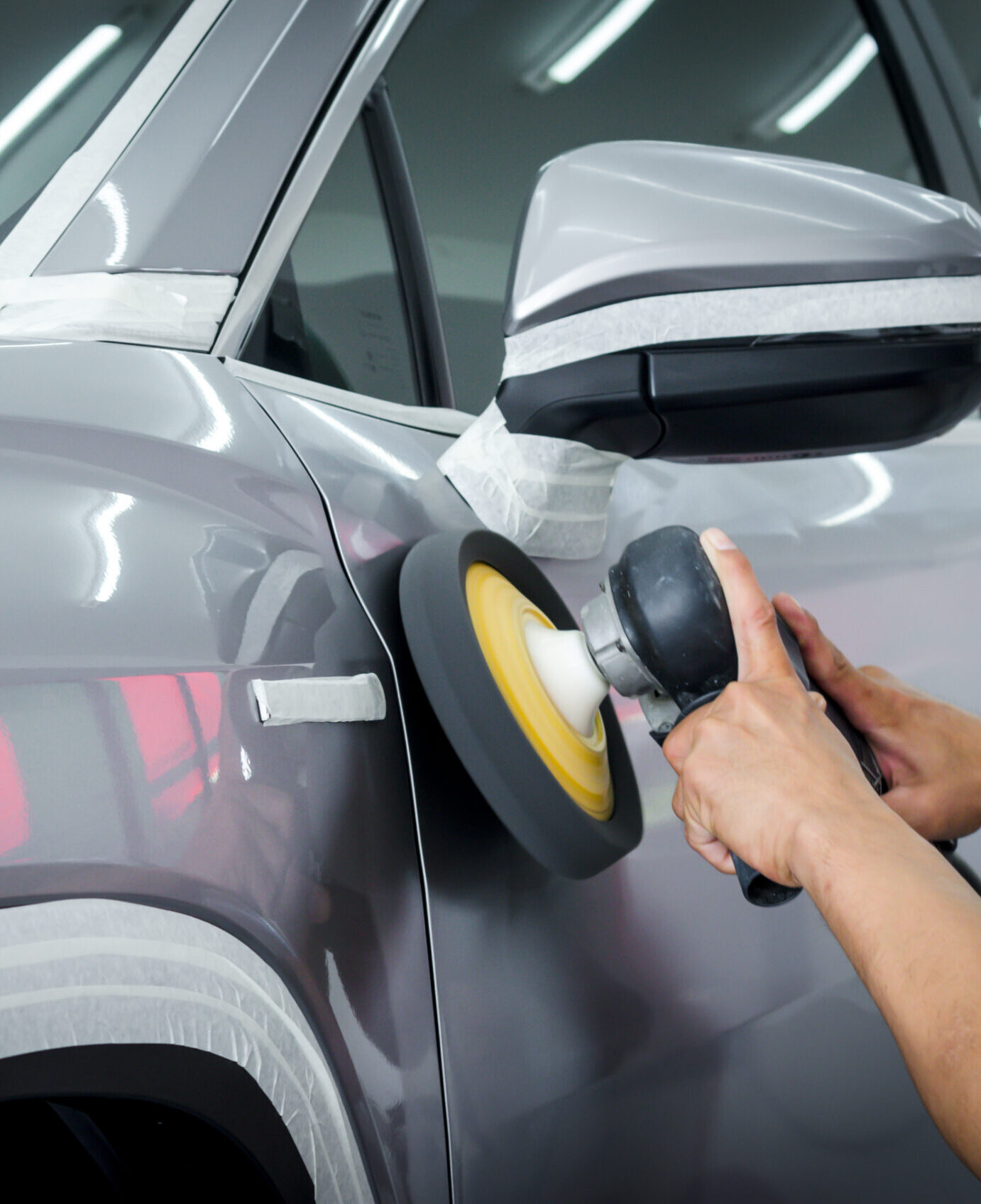 Detail: Polishing the car, preparing the car surface before coating the ceramics.